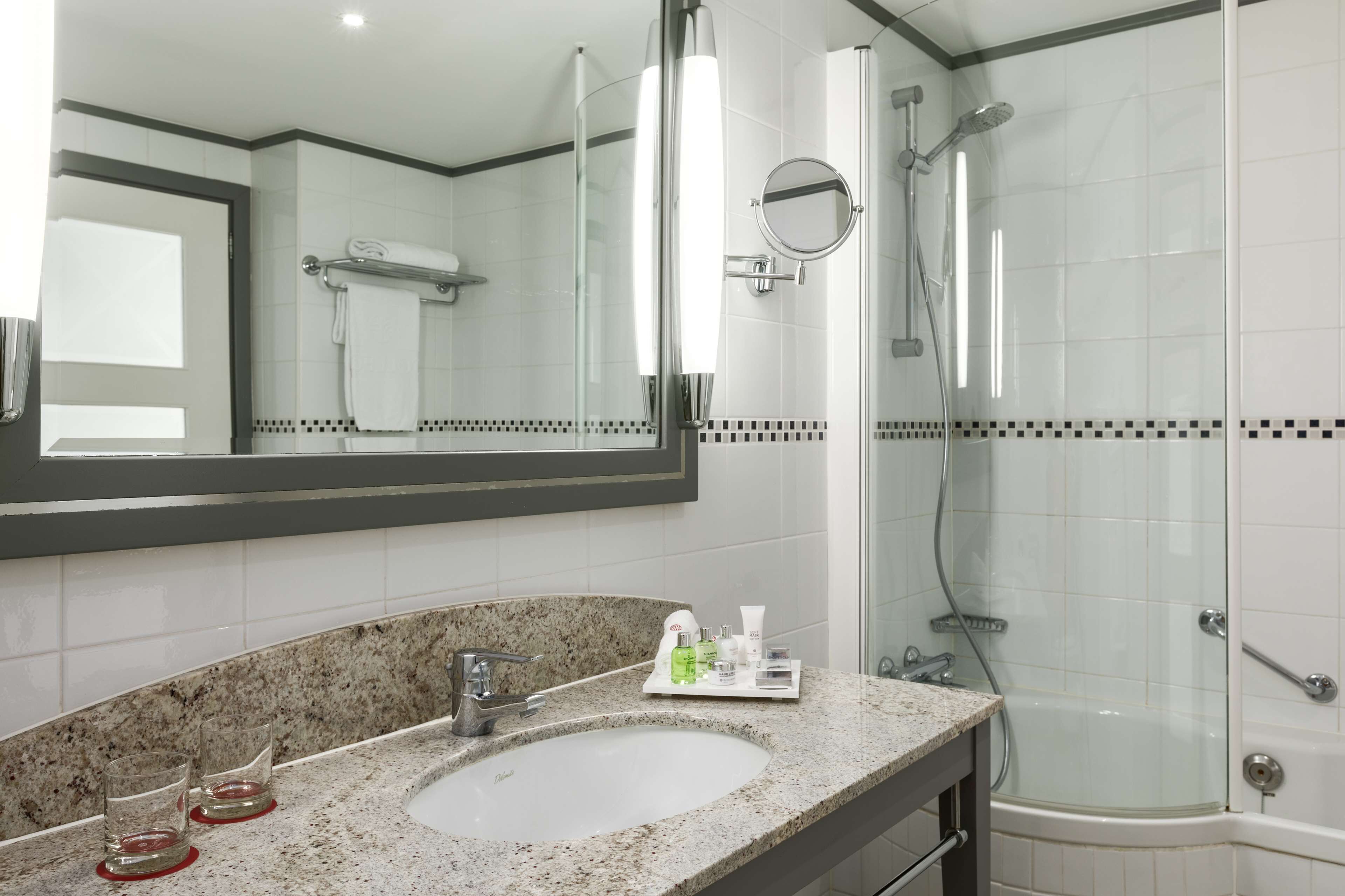 deep-soaking bathtub, rainfall showerhead, eco-friendly toiletries