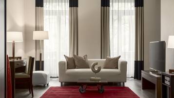 A modern living room with a sofa, coffee table, and TV.