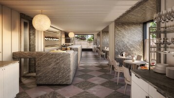 A modern bar area with marble countertops, a checkered floor, and a seating area with tables and chairs.