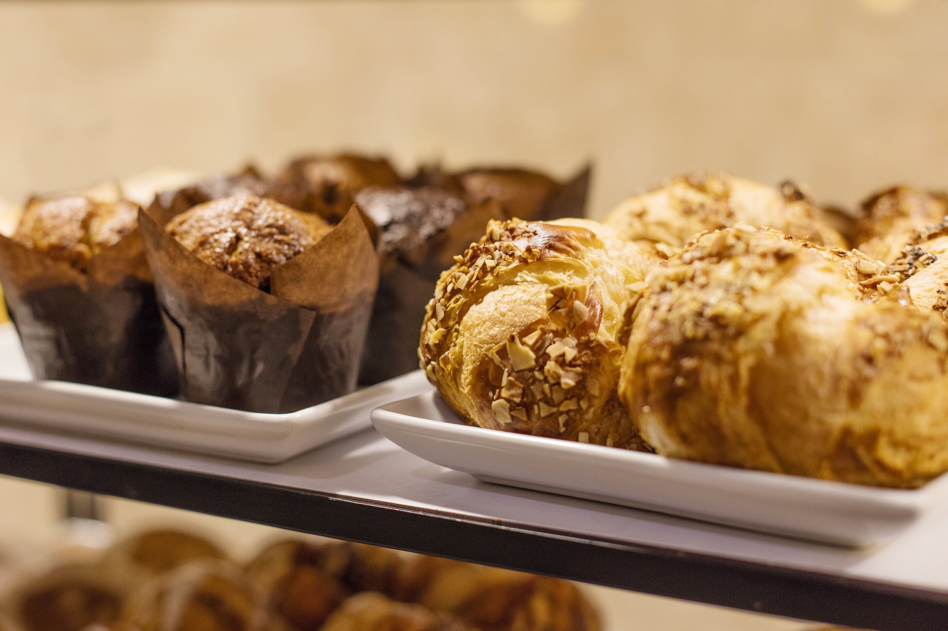 A display of pastries on trays.