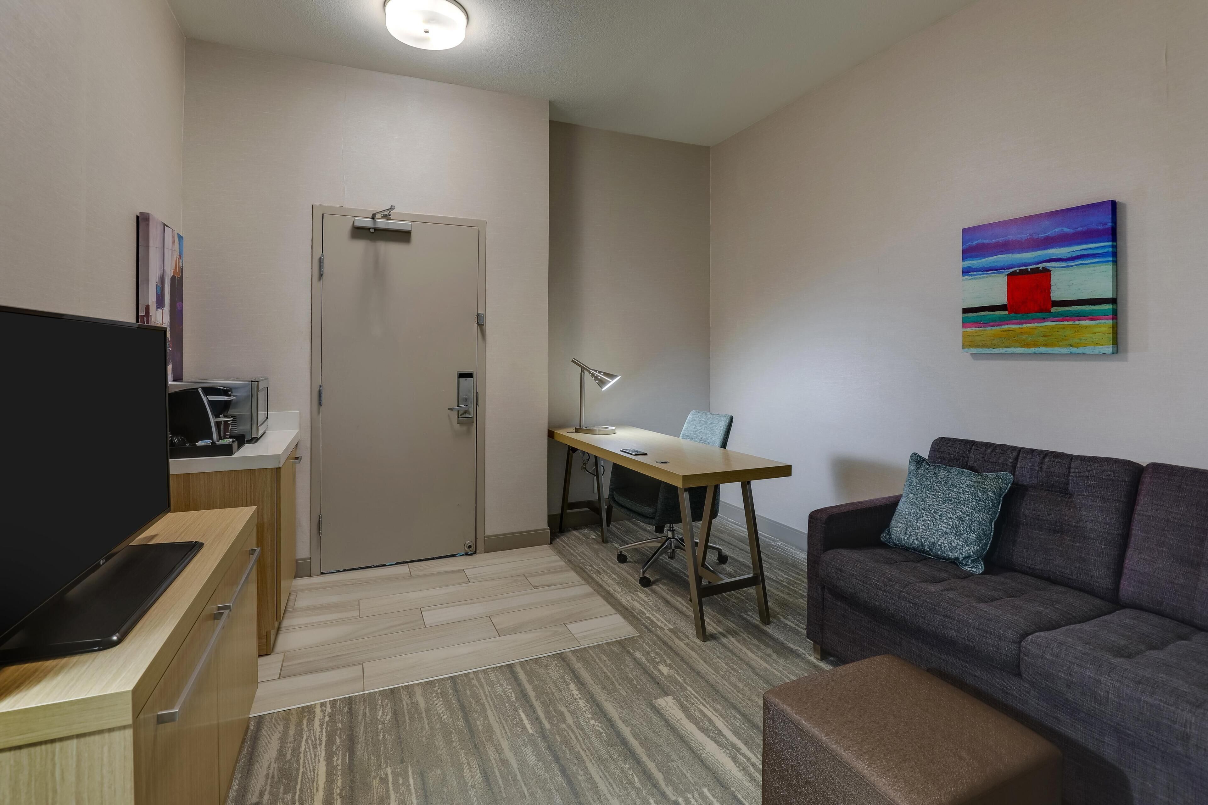 Suite, 1 King Bed, Accessible (Tub with Grab Bars) | Living area | 49-inch LCD TV with cable channels, TV, pay movies