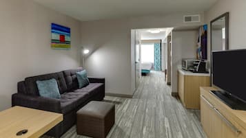 Junior Suite, 1 King Bed with Sofa bed | Living area | 49-inch LCD TV with cable channels, TV, pay films
