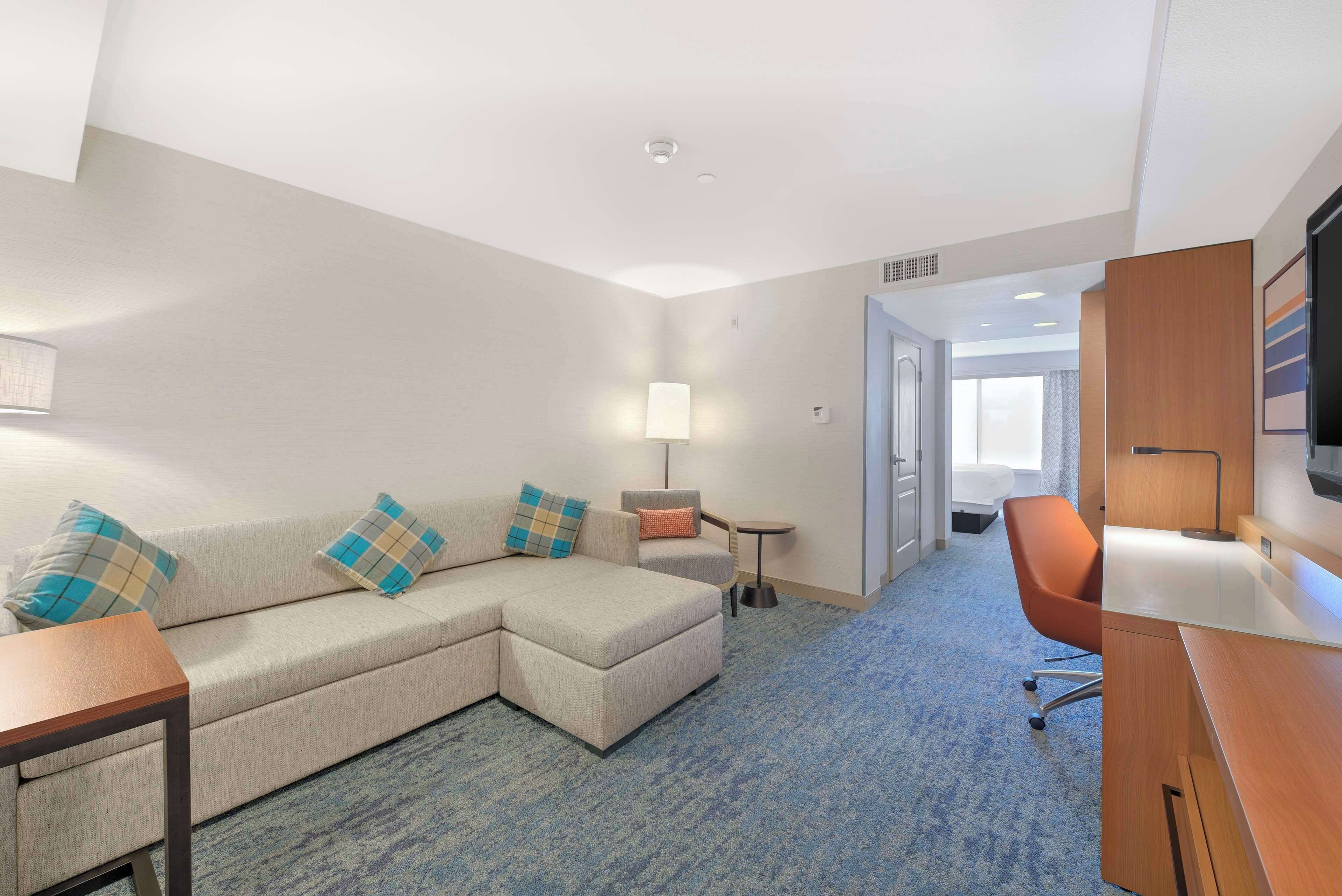 suite, 1 king bed with sofa bed, non smoking | living area | 32-inch lcd tv with cable channels, tv, mp3 dock