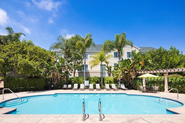 Outdoor pool, open 6:00 AM to 10:00 PM, sun loungers