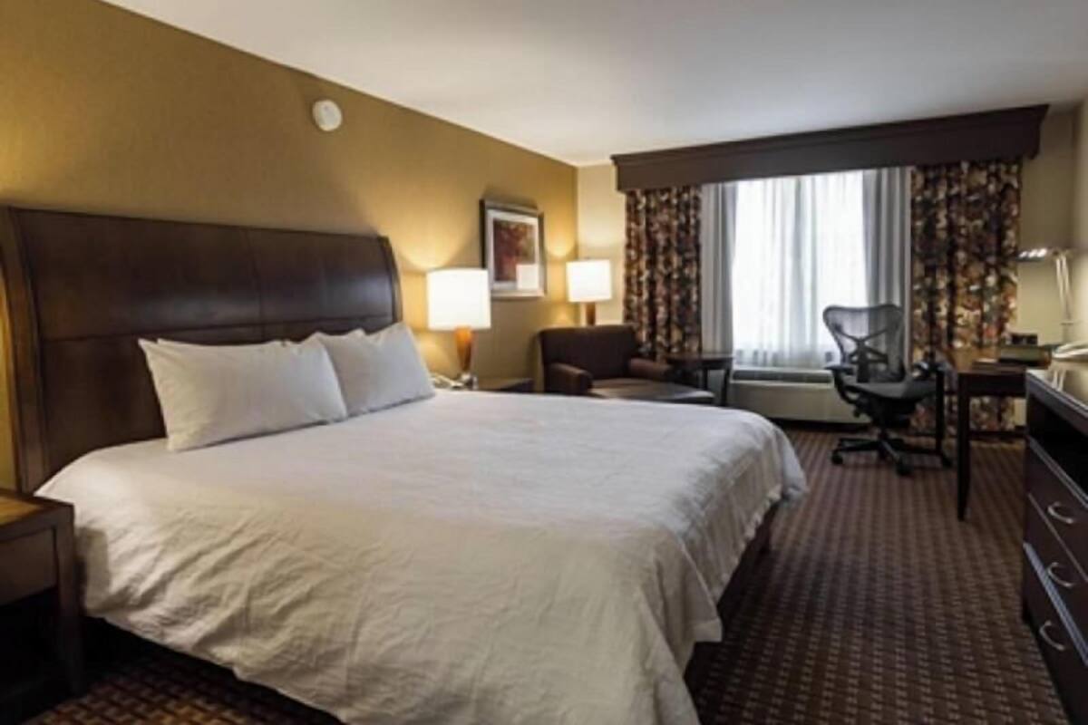Premium bedding, desk, laptop workspace, iron/ironing board