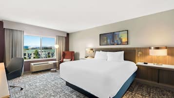 Premium bedding, desk, laptop workspace, iron/ironing board