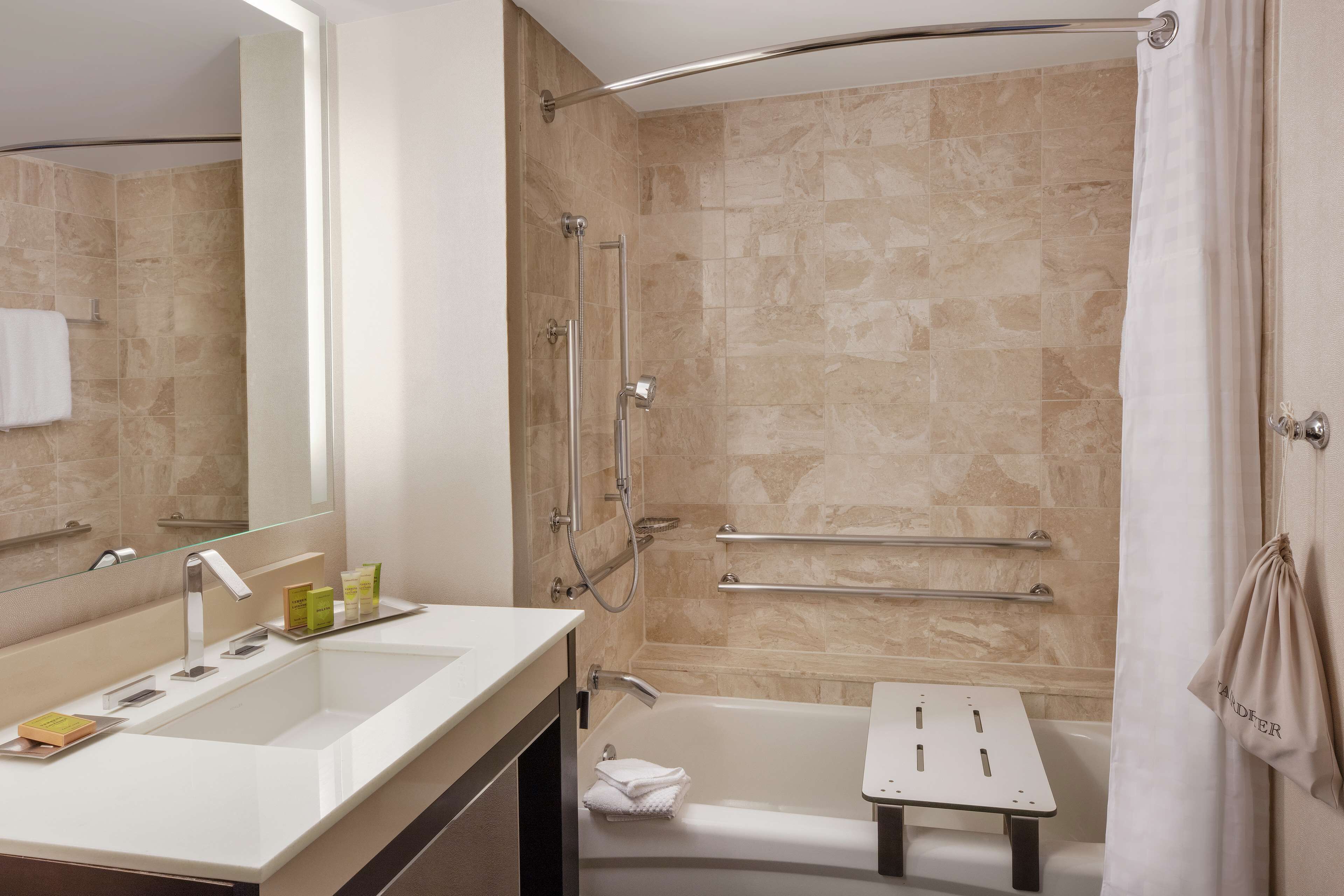 combined shower/bathtub, designer toiletries, hair dryer, towels