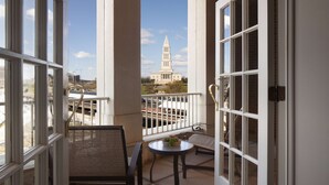 A balcony with a view of a historic building.