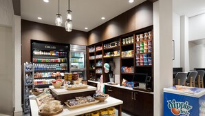 A self-service food area with chilled and frozen sections, a variety of snacks, and a Dippin' Dots ice cream cooler. - Hilton Garden Inn Chicago Downtown/Magnificent Mile (Chicago)