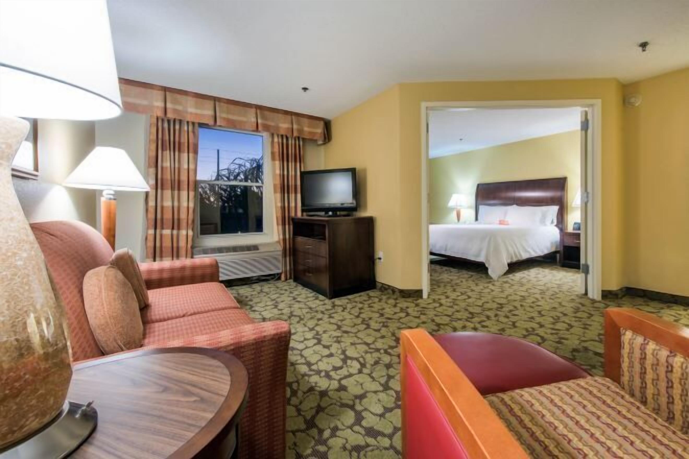 Desk, laptop workspace, blackout drapes, iron/ironing board