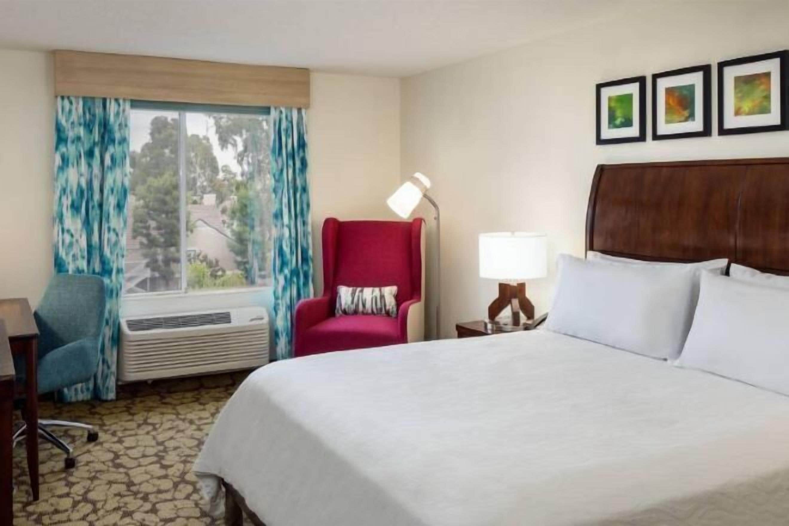 Desk, laptop workspace, blackout drapes, iron/ironing board