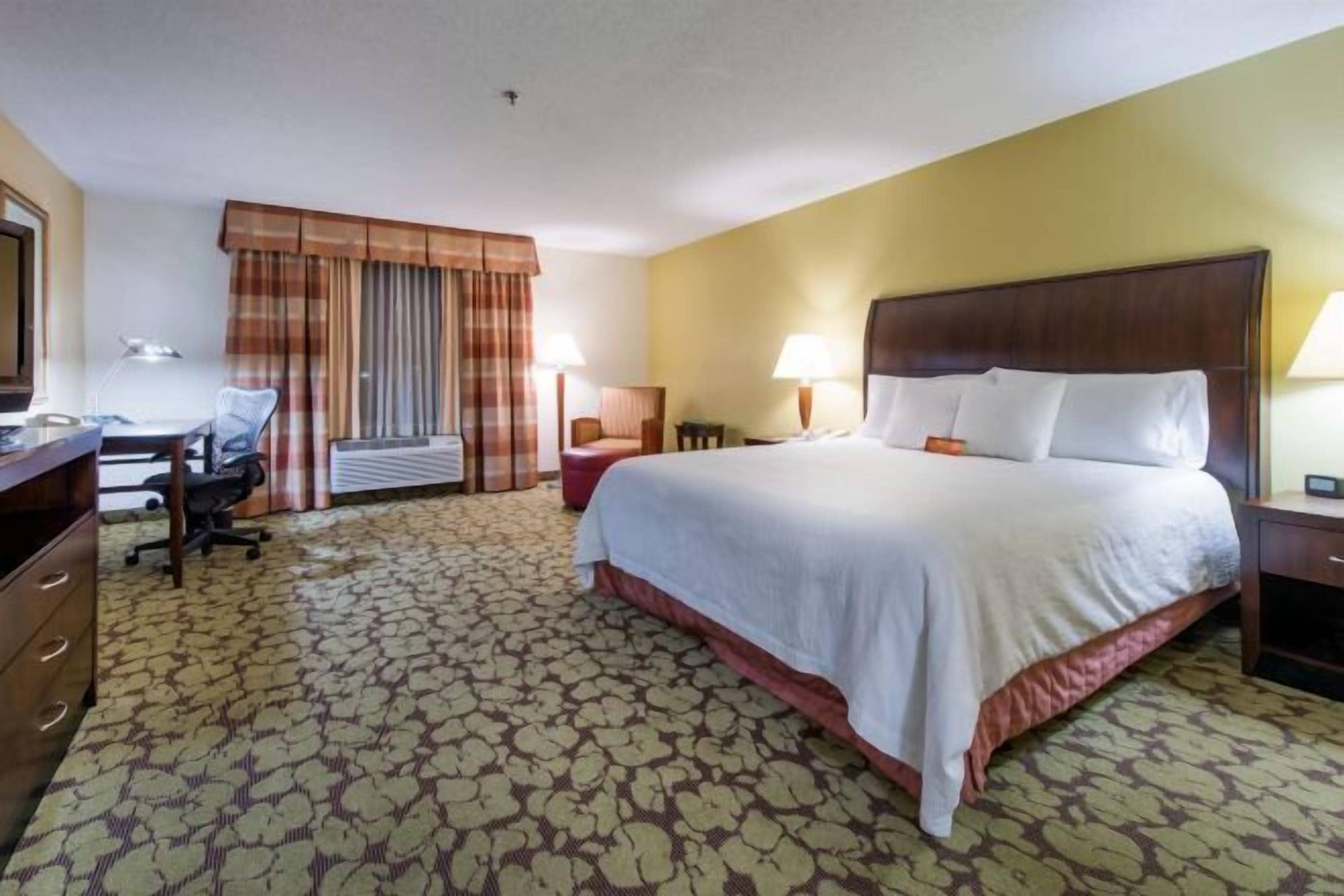 Desk, laptop workspace, blackout drapes, iron/ironing board