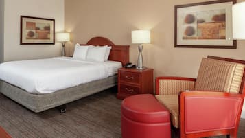 Premium bedding, desk, laptop workspace, blackout drapes