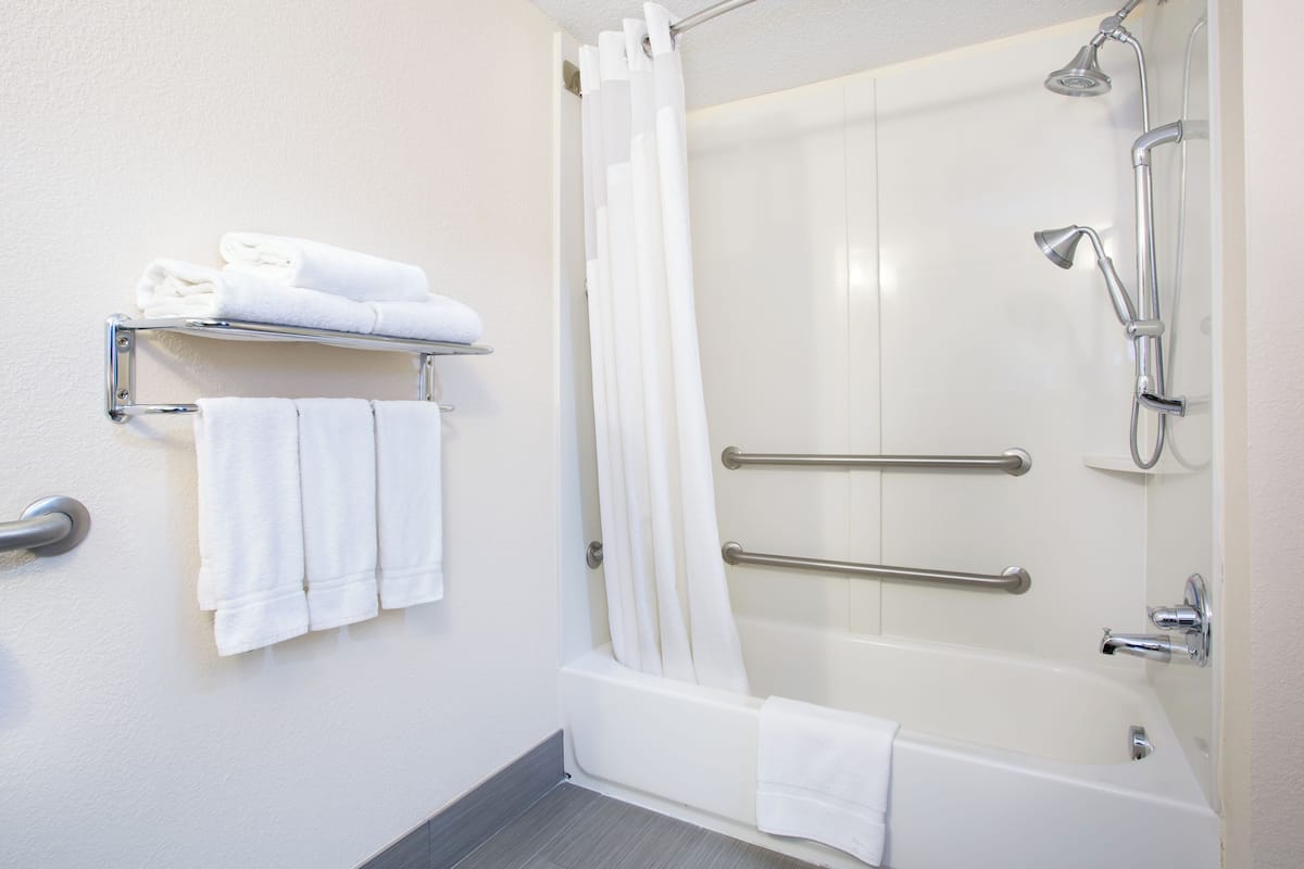 combined shower/bathtub, hair dryer, towels, soap