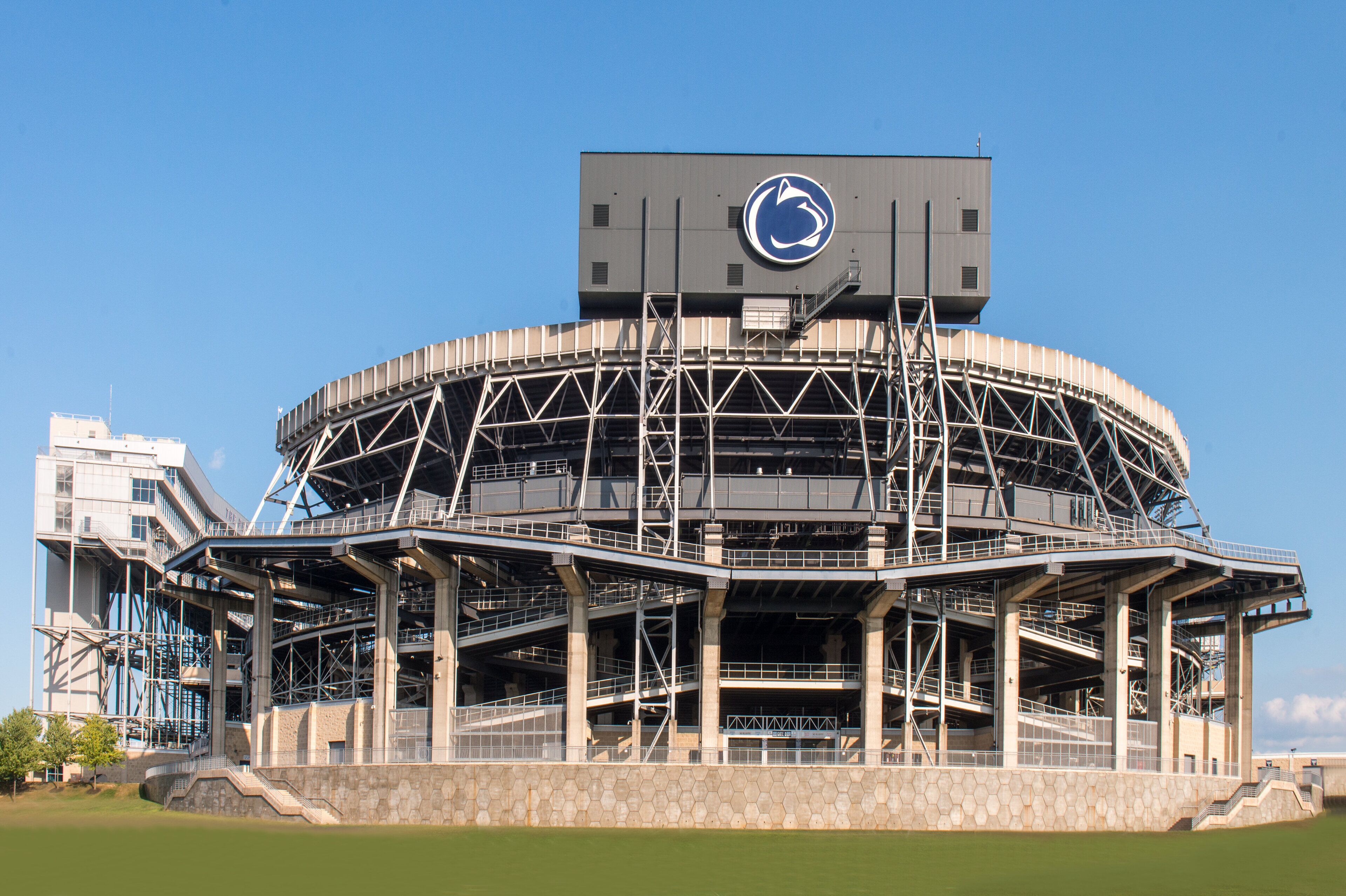 A large stadium with a circular roof structure and multiple levels of seating.