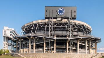 A large stadium with a circular roof structure and multiple levels of seating.