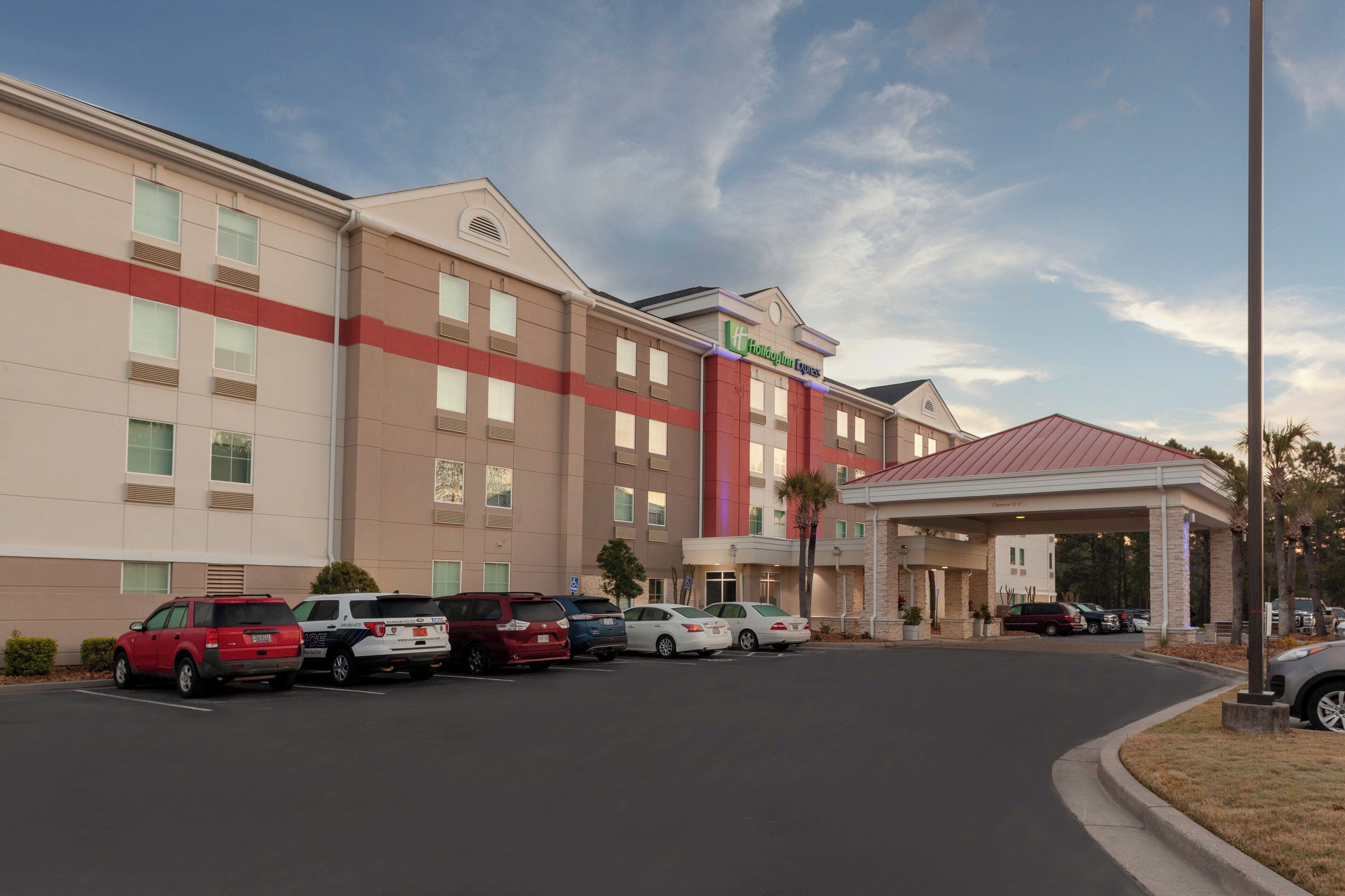 A Holiday Inn Express hotel with a parking lot and a covered entrance.