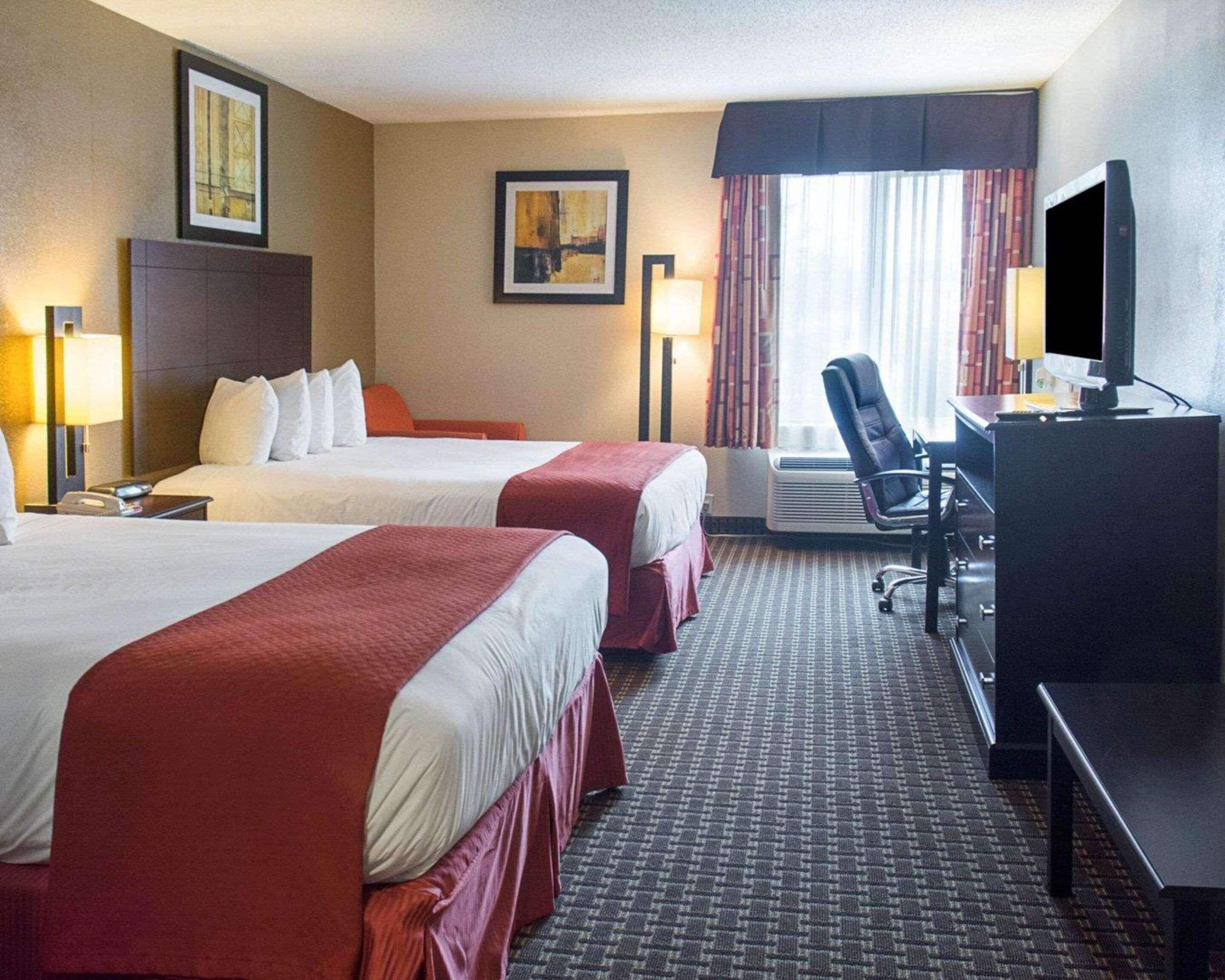 Premium bedding, desk, laptop workspace, iron/ironing board