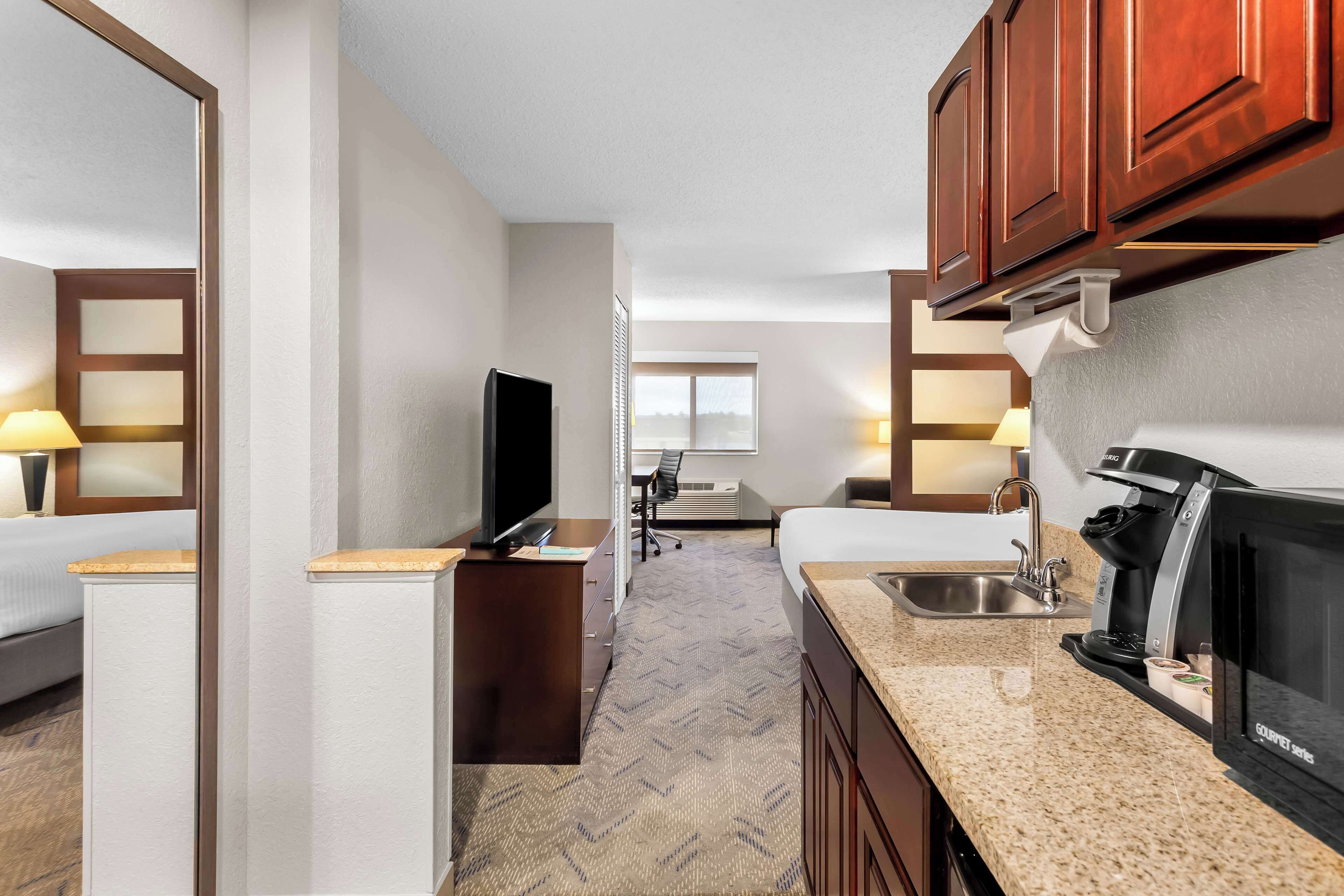 suite, 1 queen bed, accessible, refrigerator & microwave (with sofabed) | 1 bedroom, desk, laptop workspace, iron/ironing board