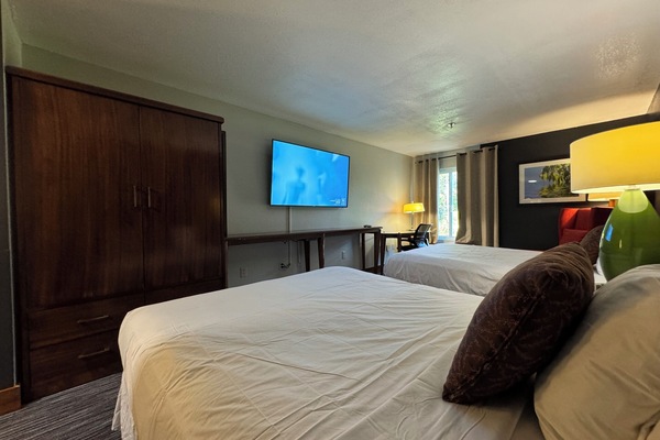 Premium bedding, desk, laptop workspace, blackout drapes