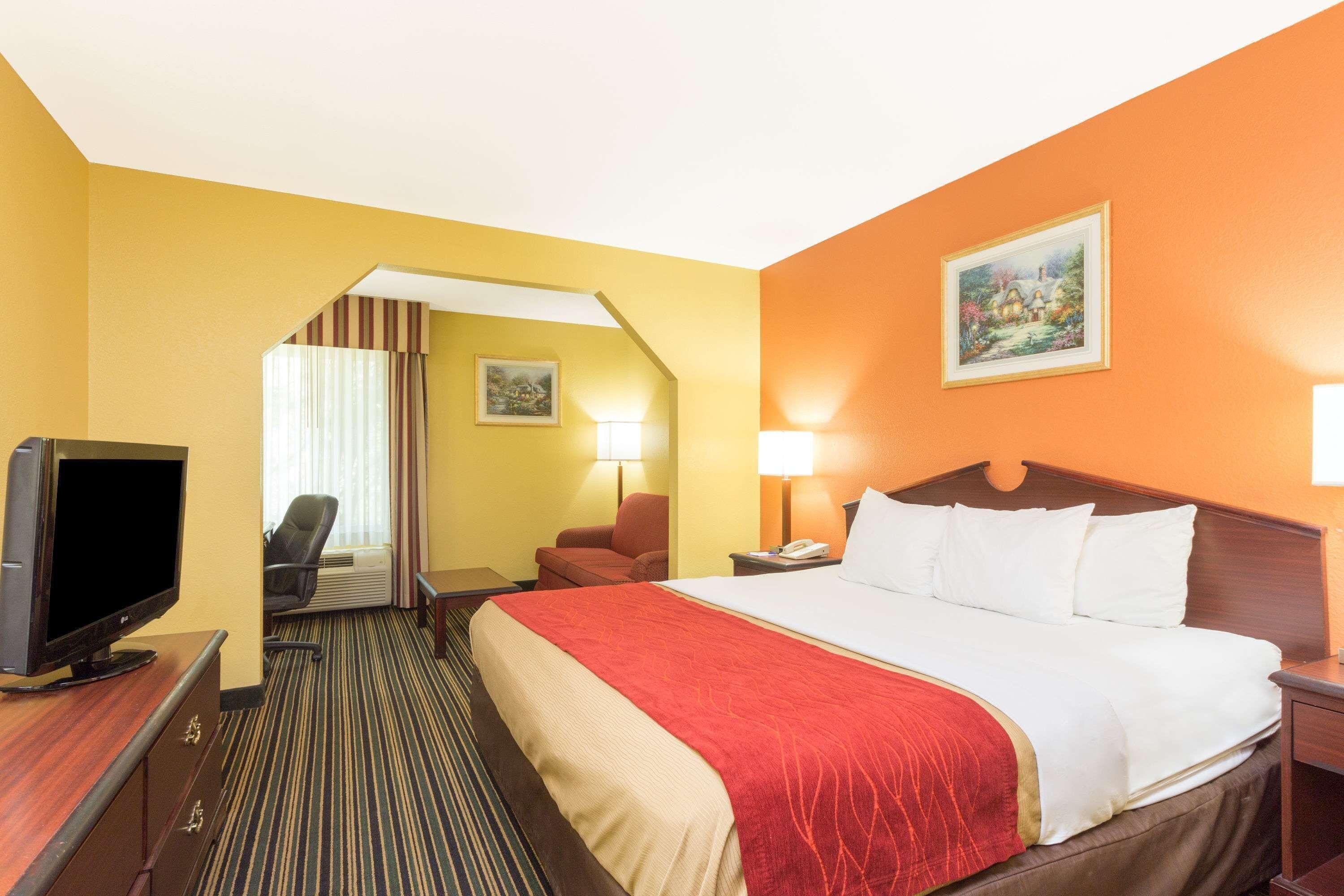 Premium bedding, desk, laptop workspace, blackout curtains