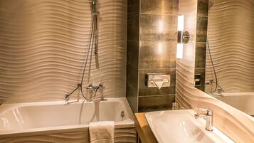 Suite, 1 King Bed with Sofa bed | Bathroom | Free toiletries, hair dryer, towels