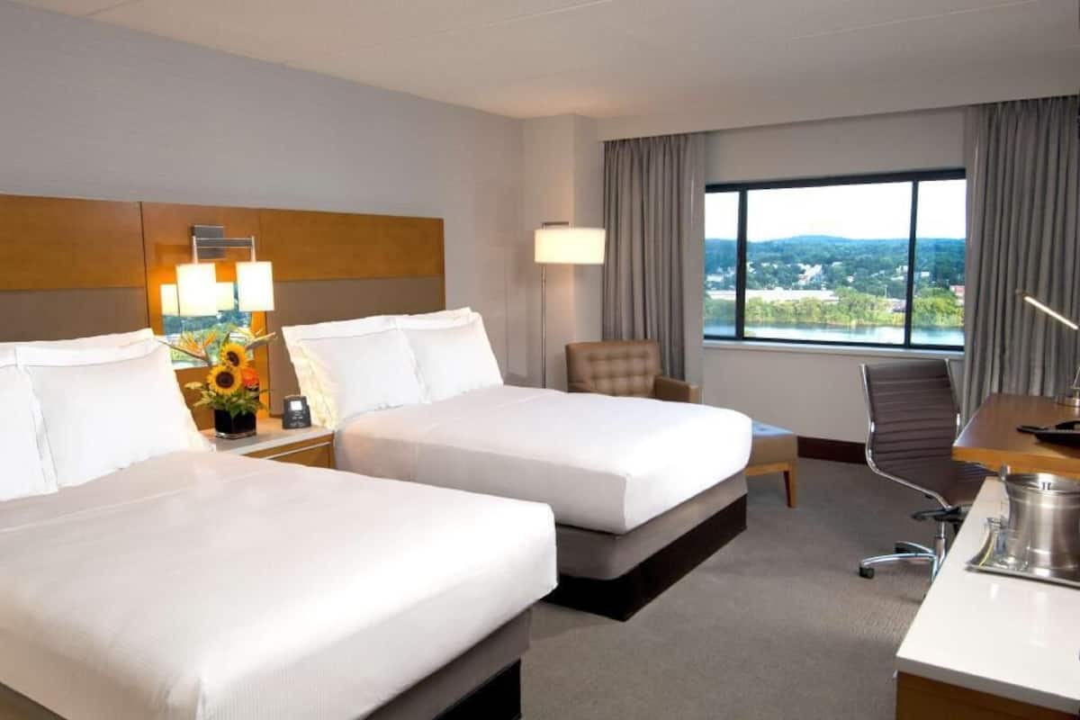 Premium bedding, down comforters, pillowtop beds, in-room safe