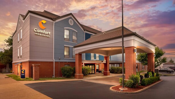 A Comfort Inn & Suites hotel with a modern design, featuring a covered entrance and a brick facade. - Comfort Inn & Suites Saint Louis Lafayette Square (St. Louis)