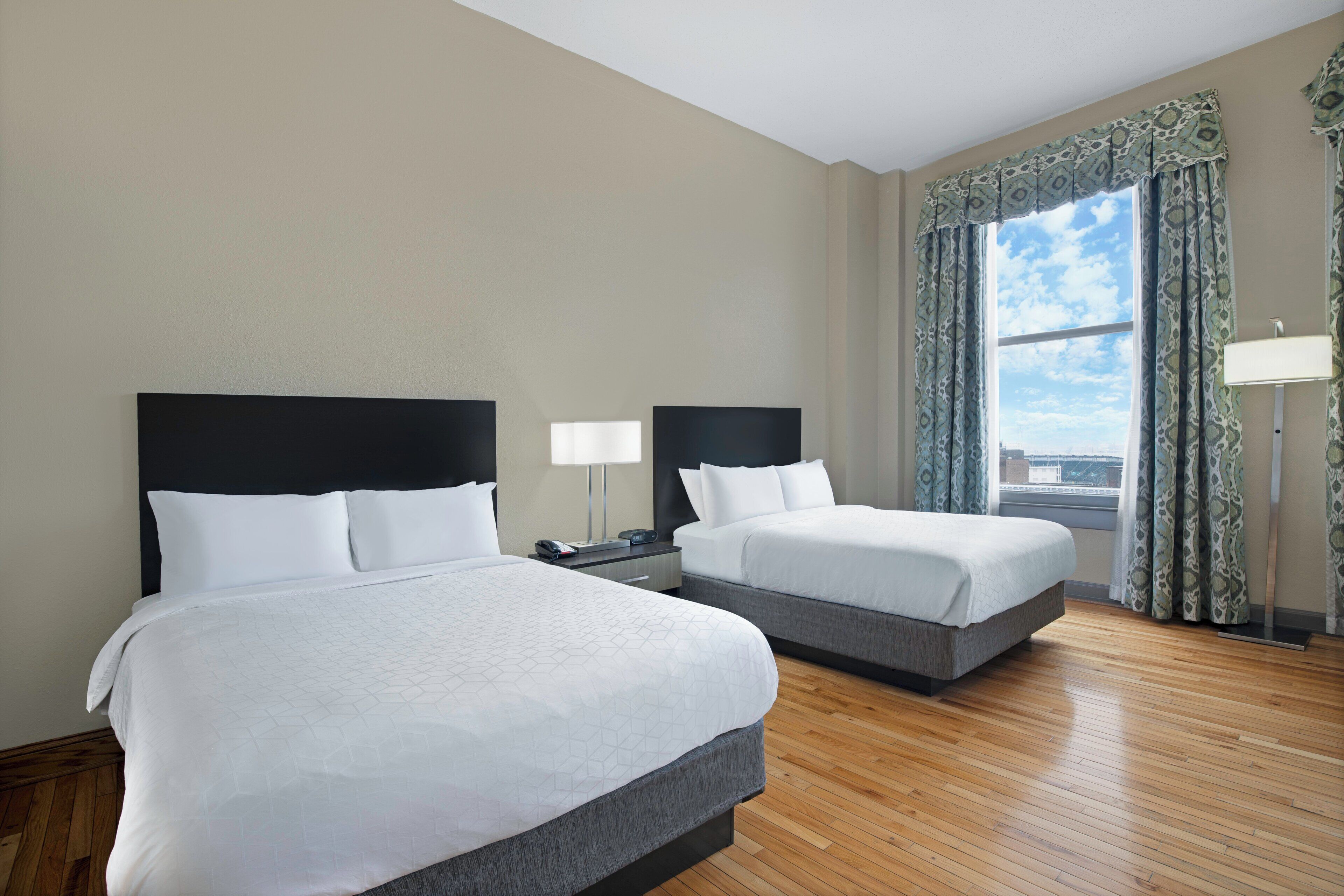 premium bedding, down duvets, blackout curtains, iron/ironing board