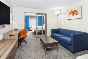 Premium bedding, desk, laptop workspace, blackout drapes