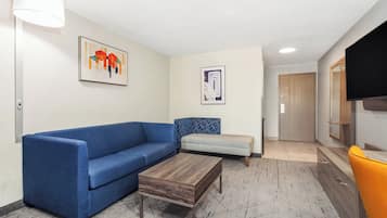 Premium bedding, desk, laptop workspace, blackout drapes