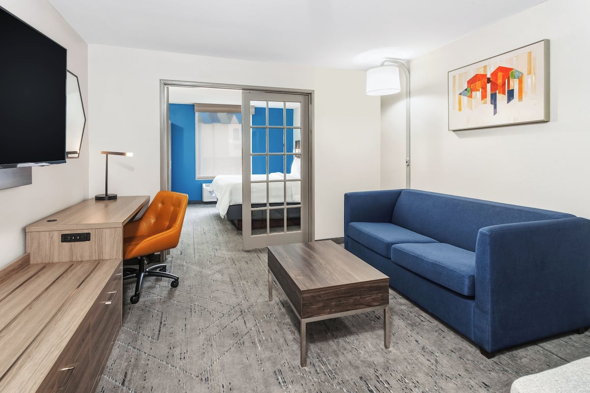 Premium bedding, desk, laptop workspace, blackout curtains