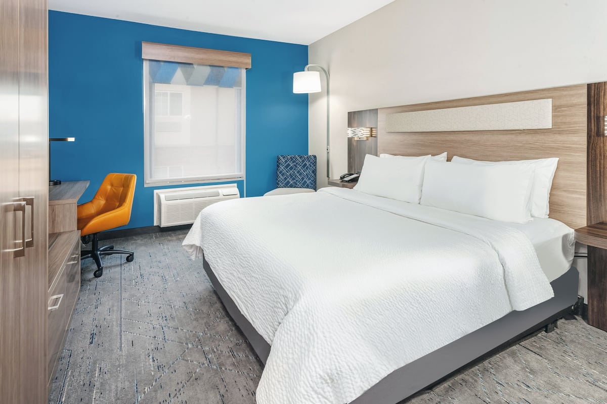 Premium bedding, desk, laptop workspace, blackout curtains