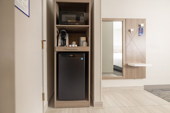 A compact kitchenette with a microwave, coffee maker, and refrigerator. - Holiday Inn Express Hotel & Suites Frackville by IHG (Frackville)