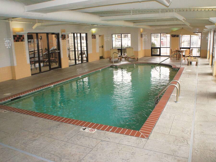 Indoor pool, open 9:00 AM to 10:00 PM, pool loungers
