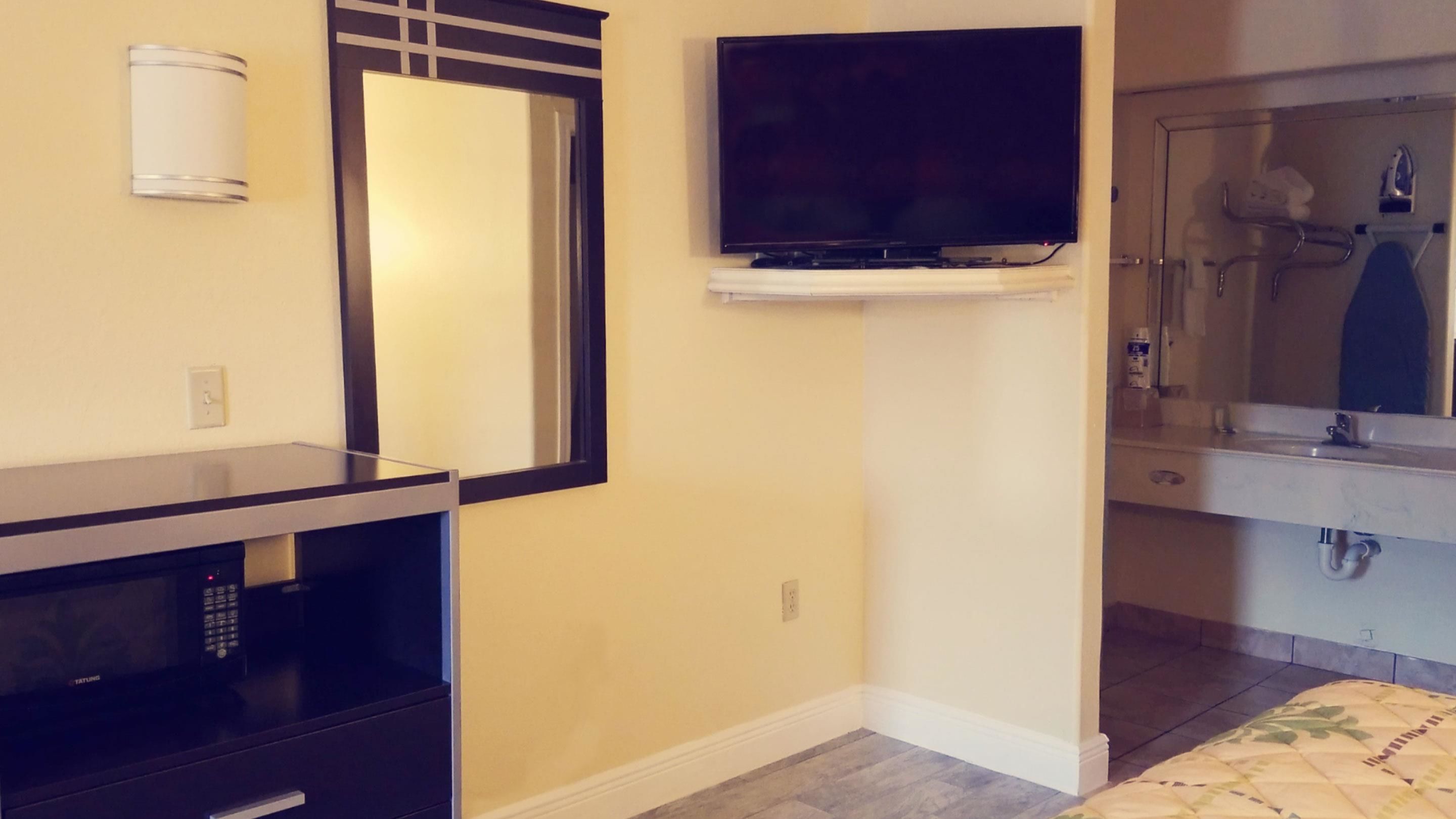 Quartos à prova de som, ferros/tábuas de passar roupa, Wi-Fi de cortesia