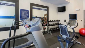 A gym with treadmills, dumbbells, and exercise balls. - Hampton Inn Memphis-Southwind (Memphis)