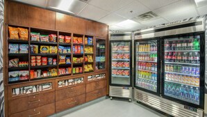 A snack and beverage vending area with various snacks and drinks. - Hampton Inn Gaffney (Gaffney)