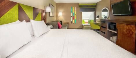 Chambre, 1 très grand lit, accessible aux personnes à mobilité réduite, non-fumeurs | Rideaux occultants, fer et planche à repasser, Wi-Fi gratuit