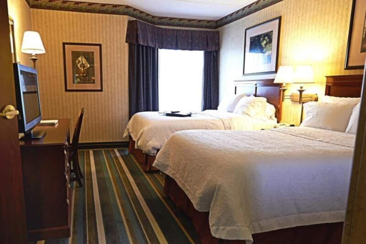 Premium bedding, pillow-top beds, desk, laptop workspace