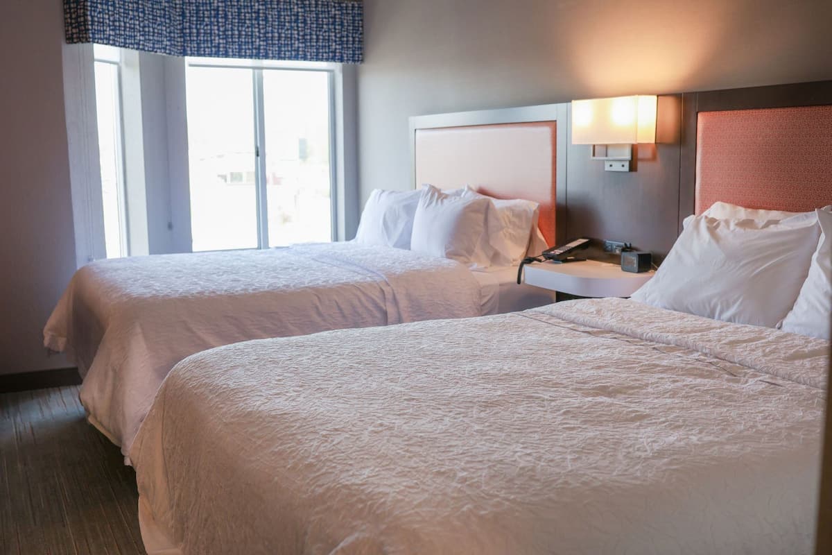 Premium bedding, pillow-top beds, desk, laptop workspace