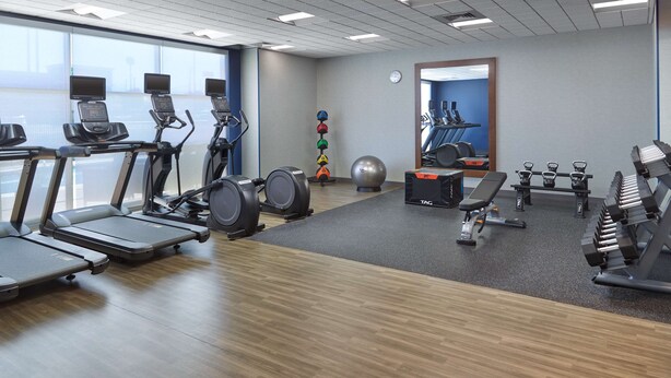 A gym with treadmills, weights, and exercise balls. - Hampton Inn & Suites Fultondale Birmingham I 65, AL (Fultondale)