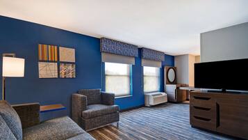 Junior Suite, 1 King Bed with Sofa bed, Non Smoking | Living area | 50-inch flat-screen TV with satellite channels, TV