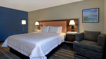 Premium bedding, desk, laptop workspace, blackout curtains