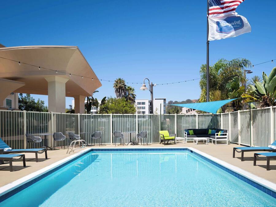 Outdoor pool, open 8:00 AM to 10:00 PM, pool umbrellas, pool loungers