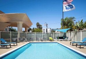 Outdoor pool, open 8:00 AM to 10:00 PM, pool umbrellas, pool loungers