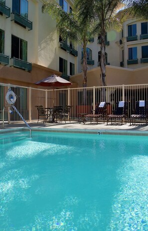 Outdoor pool, open 8:00 AM to 10:00 PM, pool umbrellas, pool loungers