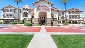 A hotel entrance with a prominent sign reading "Hampton Inn & Suites" and the year "2000" displayed. - Hampton Inn & Suites Phoenix-Goodyear (Goodyear)