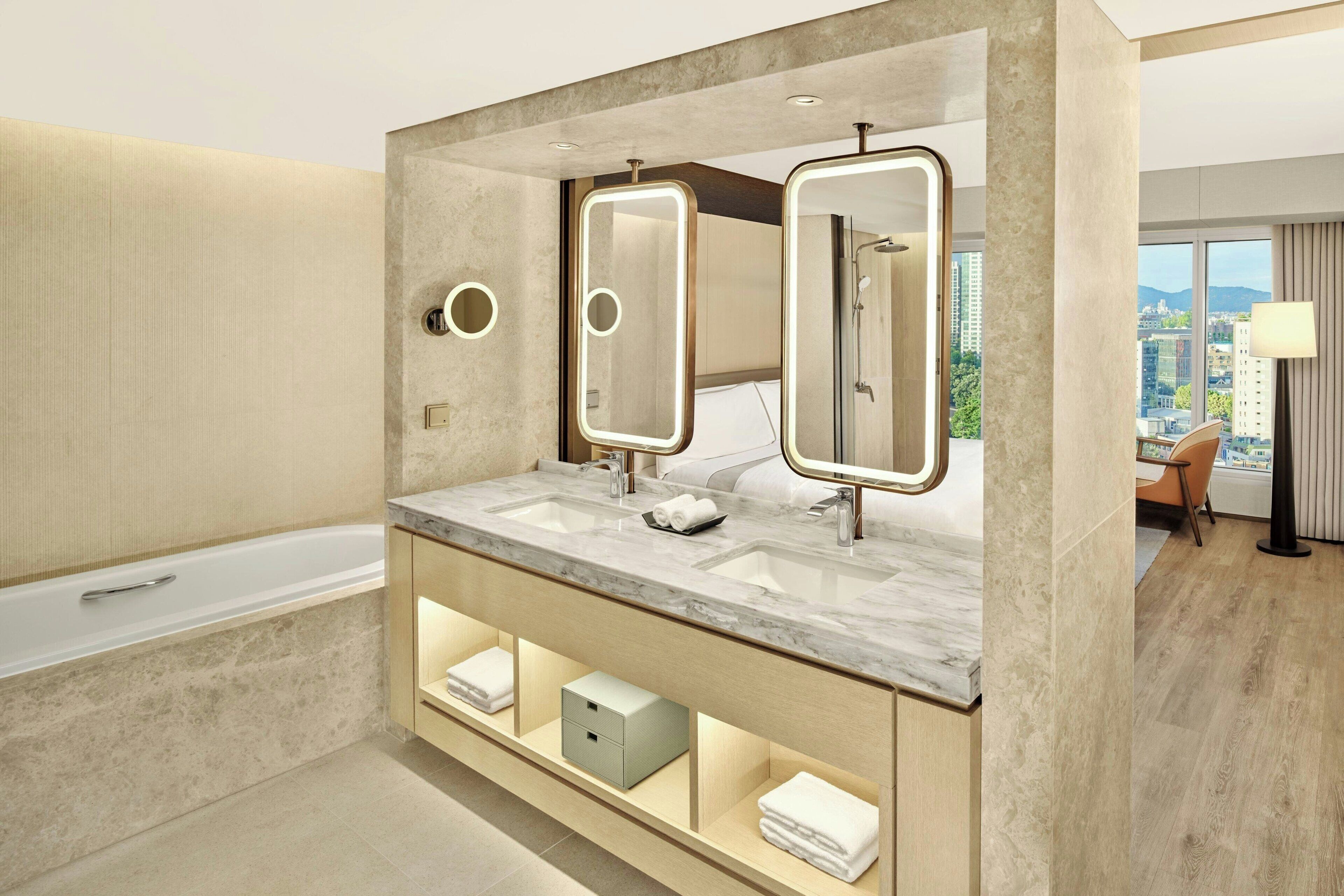Premier Suite, Club level, Suite, 1 King | Bathroom | Combined shower/bathtub, deep-soaking bathtub, hair dryer, bathrobes