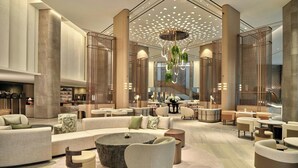 A spacious lobby with a central seating area, large columns, and a modern chandelier. - The Westin Seoul Parnas (Seoul)